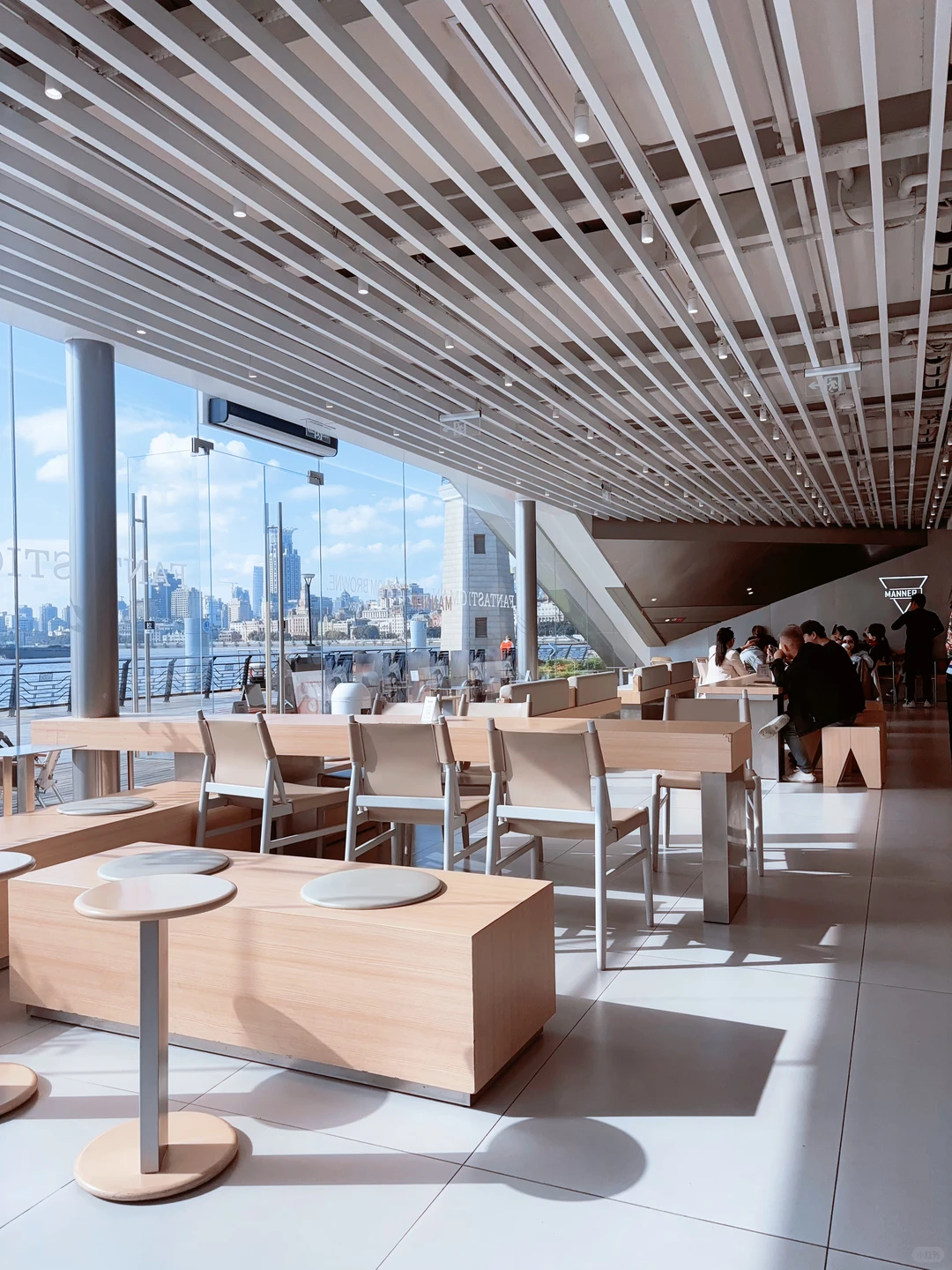 sunset view from cafe terrace with glowing city skyline