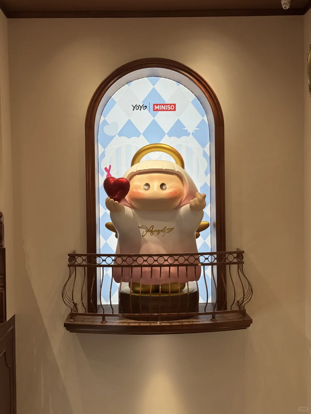 Colorful ship-themed MINISO LAND exterior with giant YOYO character statue