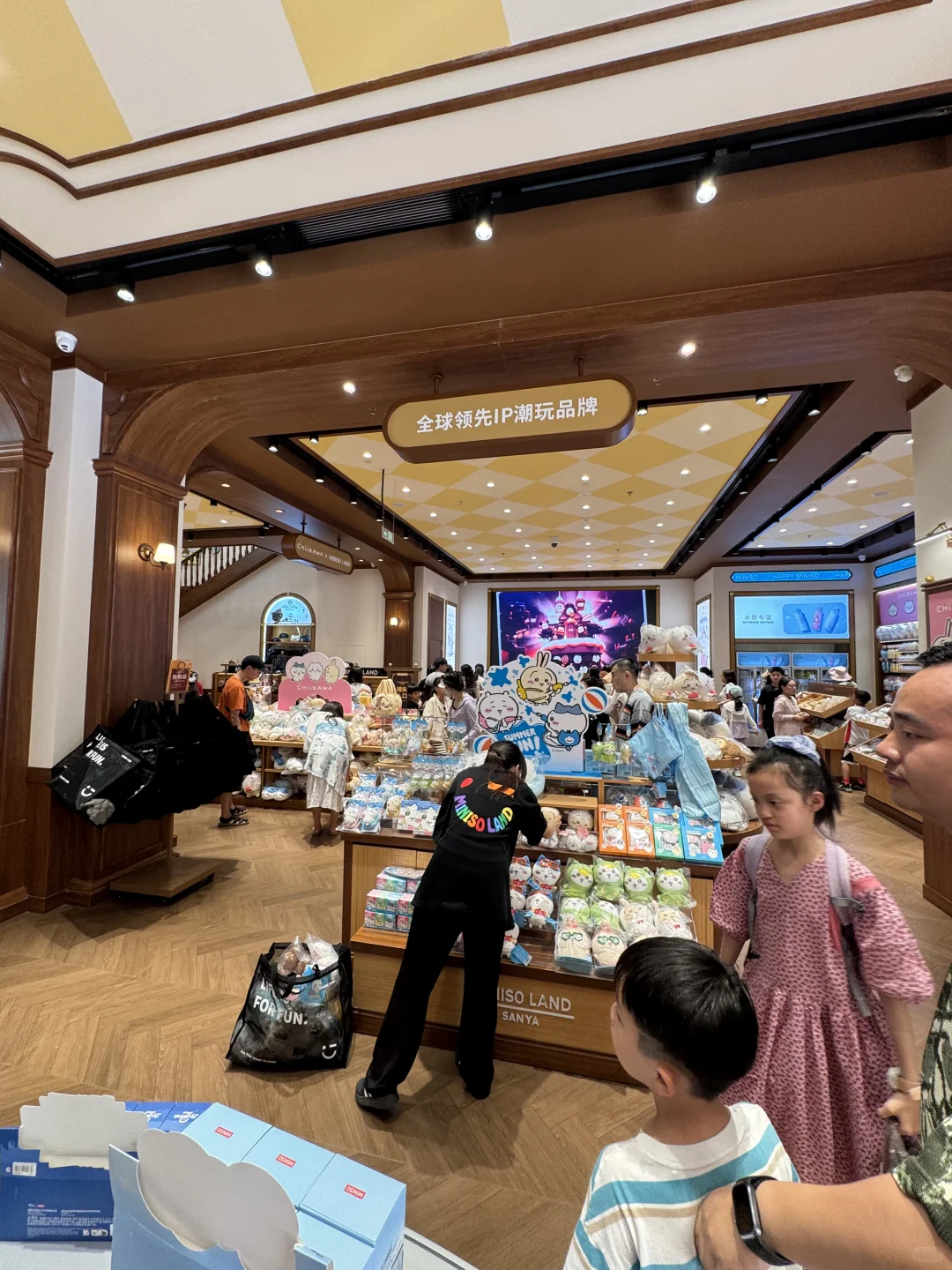 Interior view showing colorful IP merchandise displays with Sanrio and Disney characters