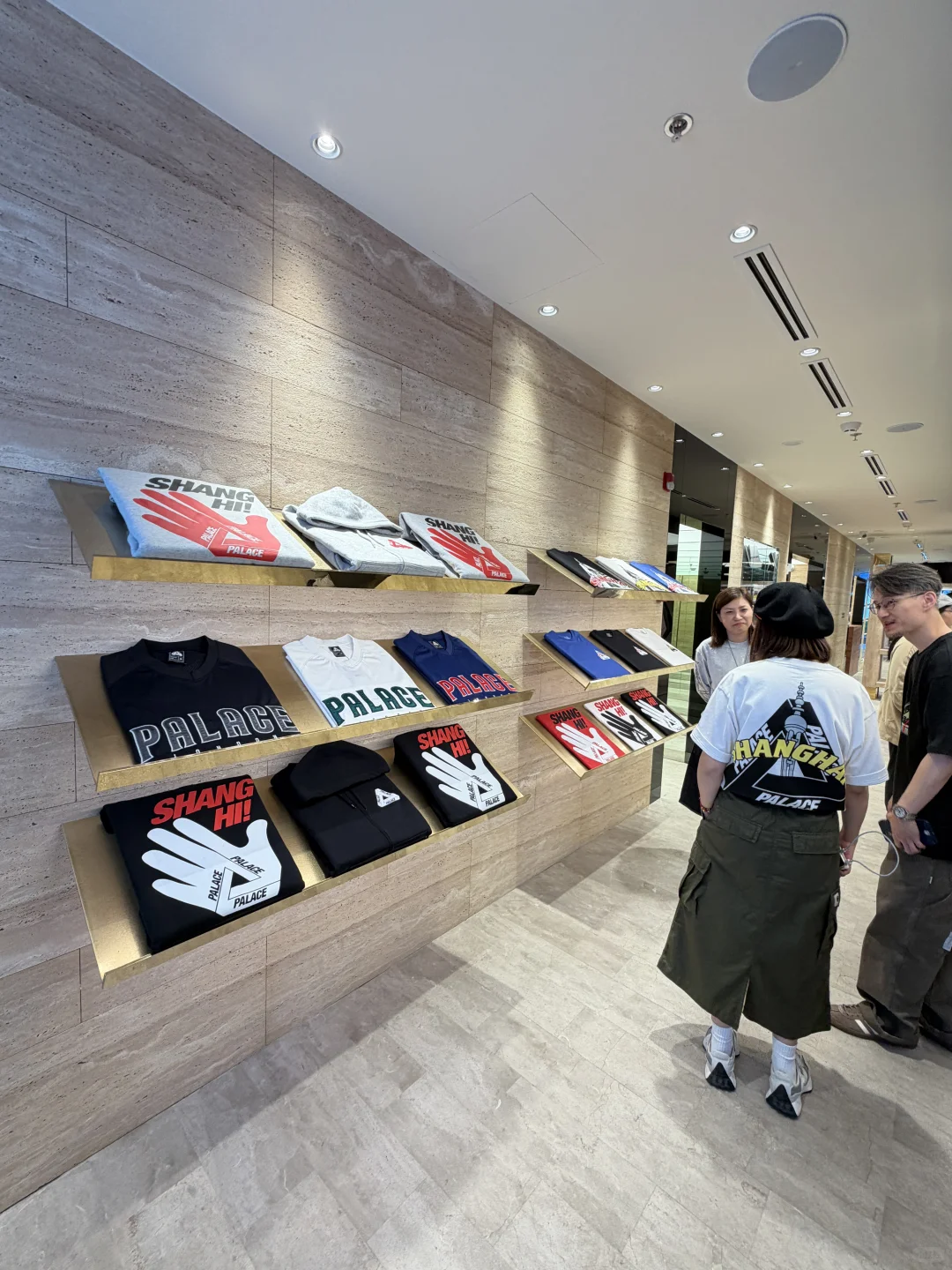 Palace store interior showing Chinese garden-inspired pavilion structure with stone tiles and LED columns